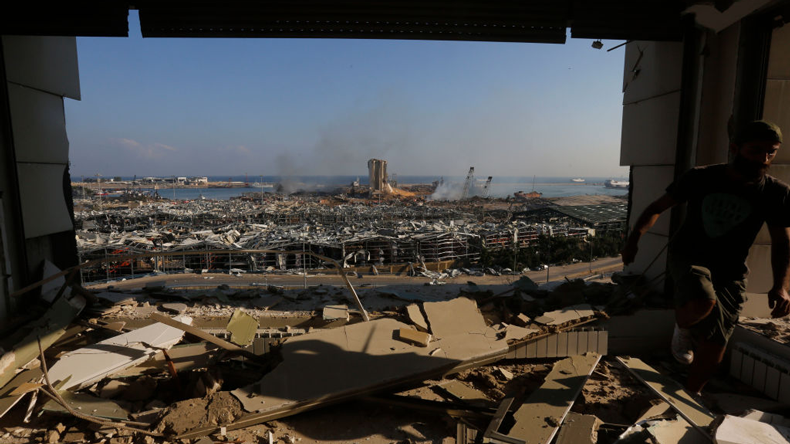 Day after the blast: Beirut port seen through a shattered building Credit: Marwan Tahtah/Getty Images