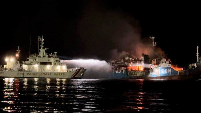Philippine Coast Guard tries to extinguish fire on the MV Lady Mary Joy at Basilan, southern Philippines 