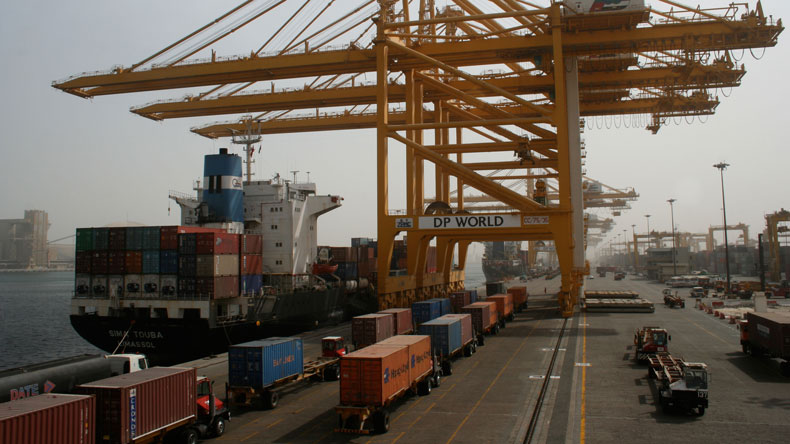 DP World Dubai Ports World Container Port UAE. Container lorries at port, with containership at berth