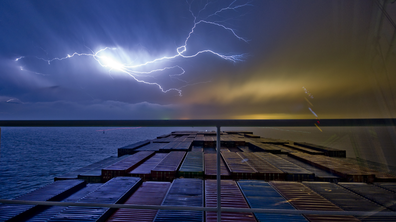 containership and stormy sky donvictorio/Shutterstock.com