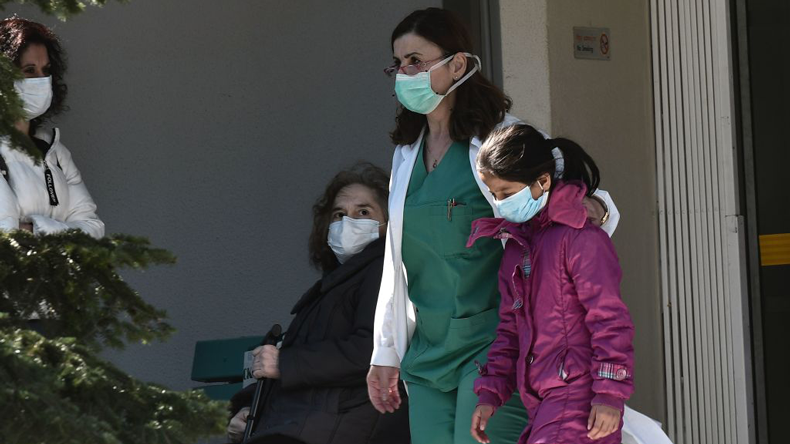 Masks on at a hospital in Thessaloniki, by Sakis MIitrolidis/AFP via Getty Images