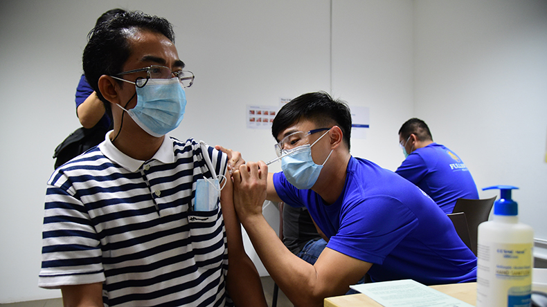 One of the first non-resident foreign sea crew getting a coronavirus vaccination in Singapore credit Maritime and Port Authority of Singapore 