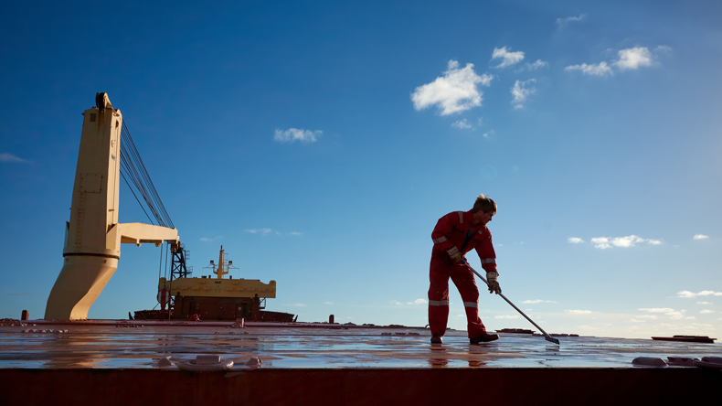 Seafarer working on deck in the Atlantic. Credit Denys Yelmanov/Shutterstock.com
