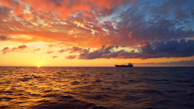 Baltic sunset with ship on horizon.  Alex Stemmer/Shutterstock.com