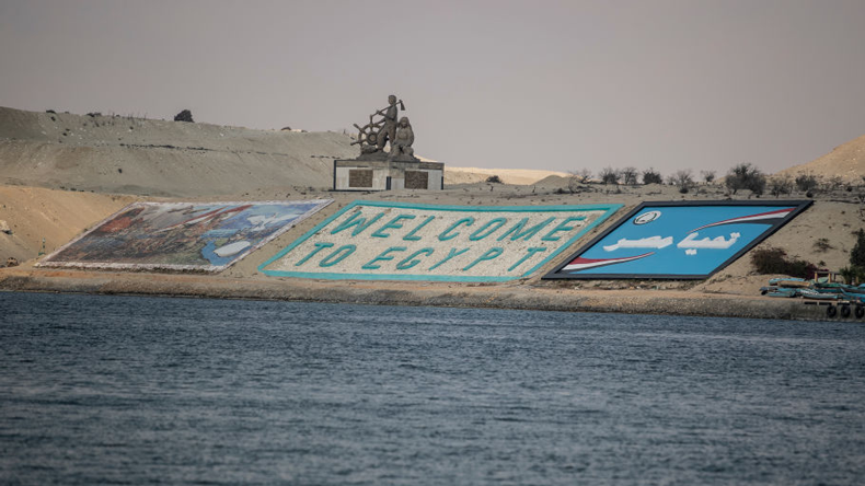 Sign seen across Suez Canal at Ismailia. Credit Mahmoud Khaled / Getty Images