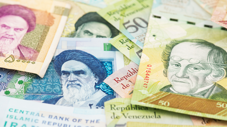 Iranian and Venezuelan bank notes. Mc_Cloud/Shutterstock.com
