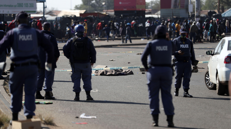 Police and protesters in South Africa during protests over arrest of Jacob Zuma