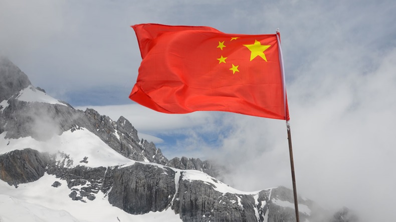 Chinese flag in snowy landscape