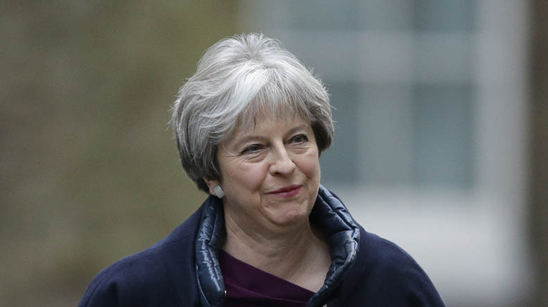 Britain's Prime Minister Theresa May returns to 10 Downing Street in London, Monday, Jan. 8, 2018, ahead of an expected Cabinet reshuffle.