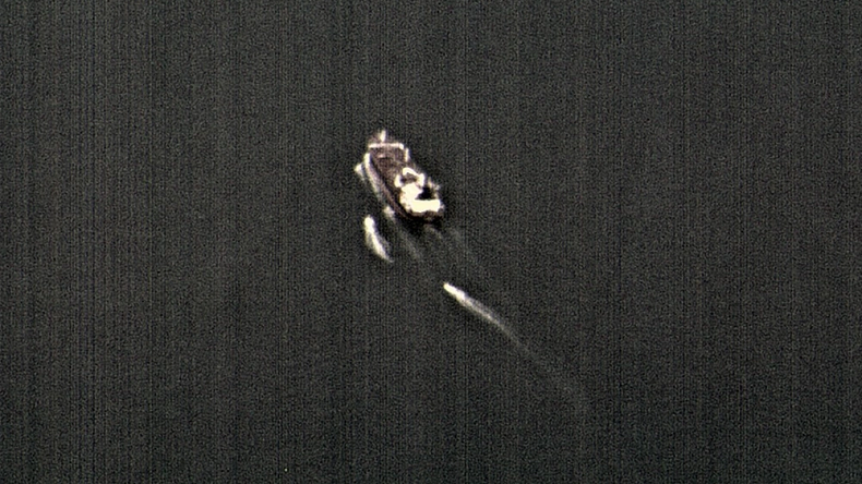 Satellite image of fast-attack ships harassing a tanker