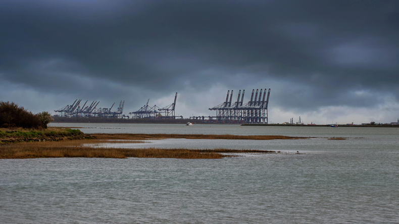 Looking across Levington Creek to the port of Felixstowe in Suffolk. Credit Rob Atherton / Alamy Stock Photo