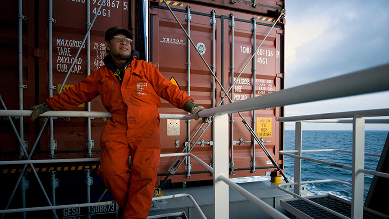 Indonesian seafarer on containership Credit: agefotostock  / Alamy Stock Photo