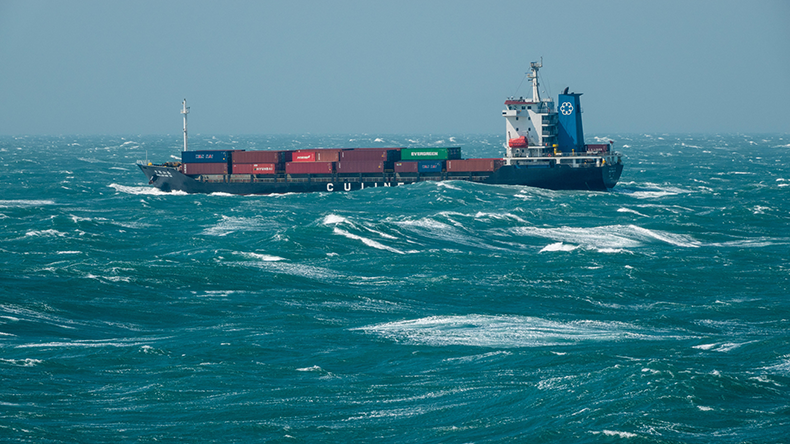 Containership travelling through rough seas