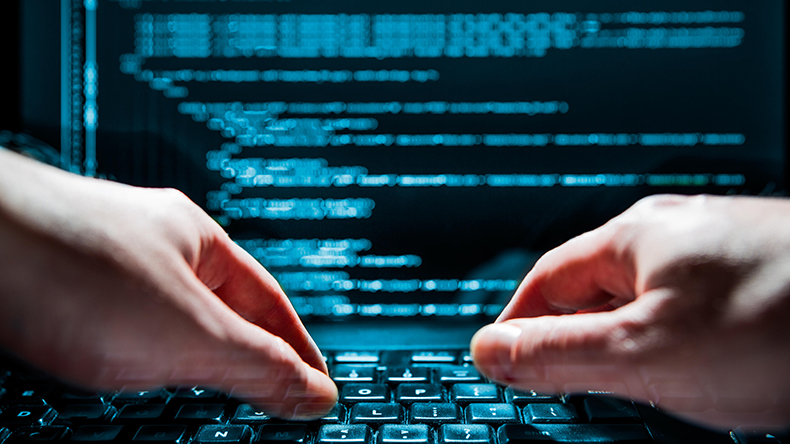Hacker using laptop data loss credit Artur Marciniec / Alamy Stock Photo