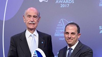 Pavlos Ioannidis being presented by with his award by Cyprus’ Minister of Transport, Communications & Works Marios Demetriades.