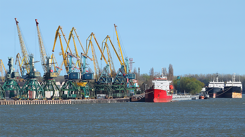 Port cargo crane and ship at Danube river port of Izmail