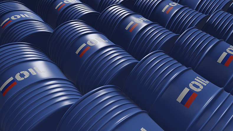 Blue metal oil barrels with Russia flag and oil written on them